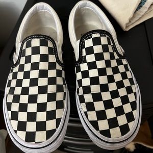 Checkered Vans slip ons